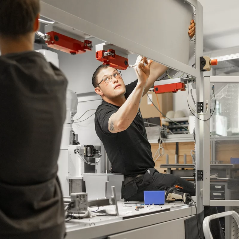 Employees mixing a cradle-to-cradle system